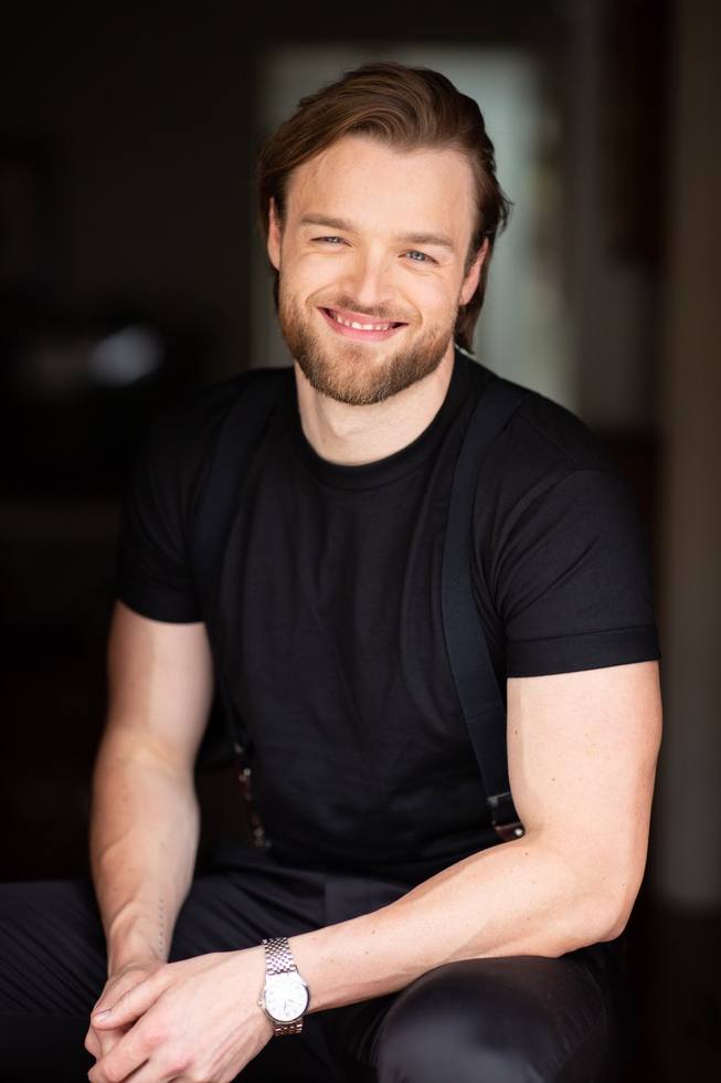 Haydan Hawkins, seated
