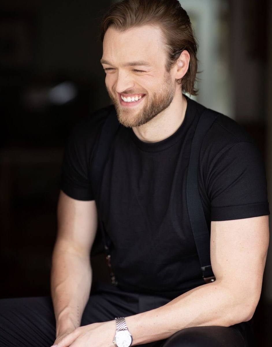 Haydan Hawkins seated portrait, laughing