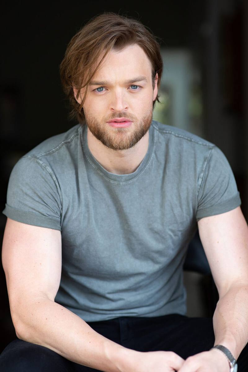 Haydan Hawkins headshot, seated