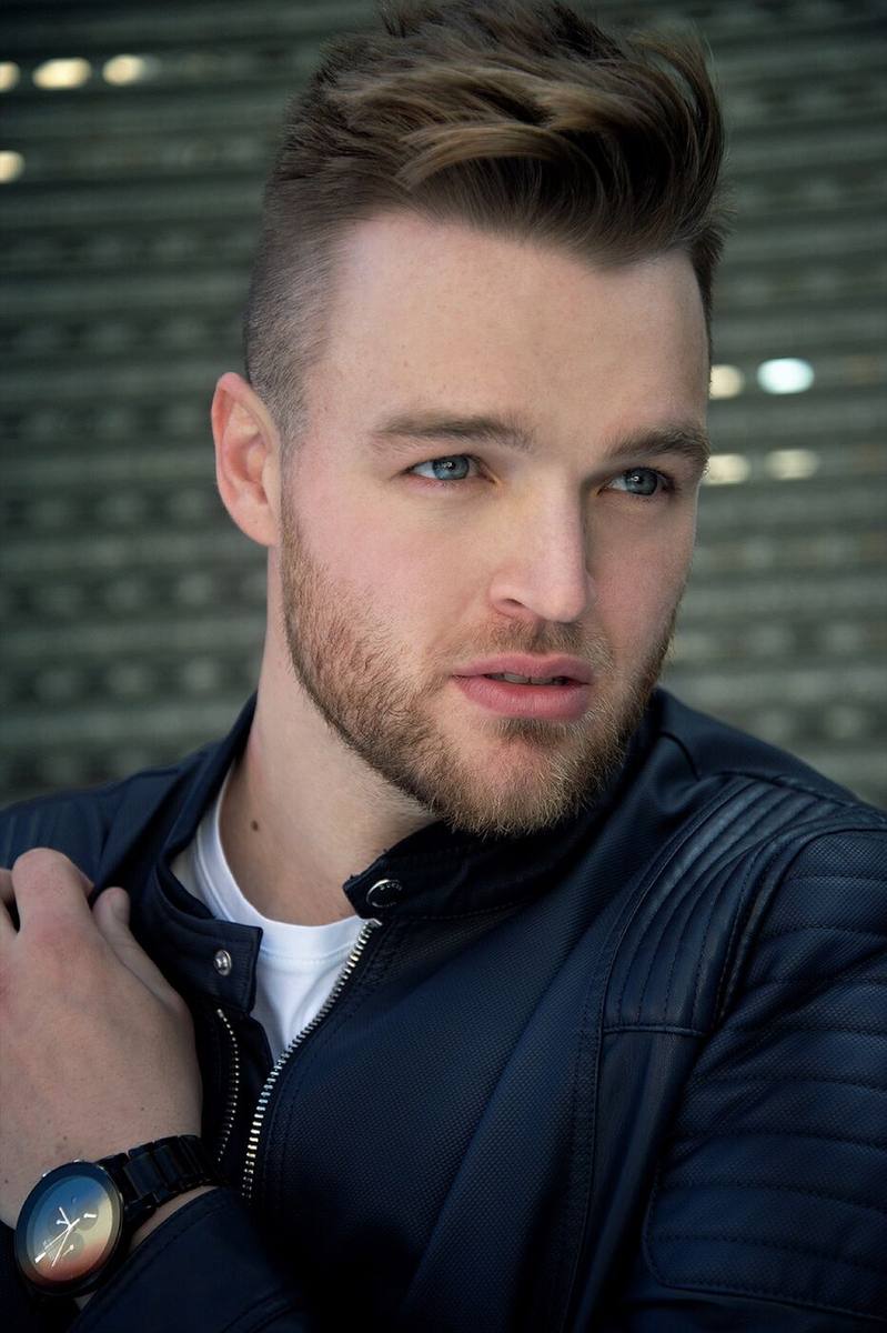 Haydan Hawkins earlier headshot, leather jacket