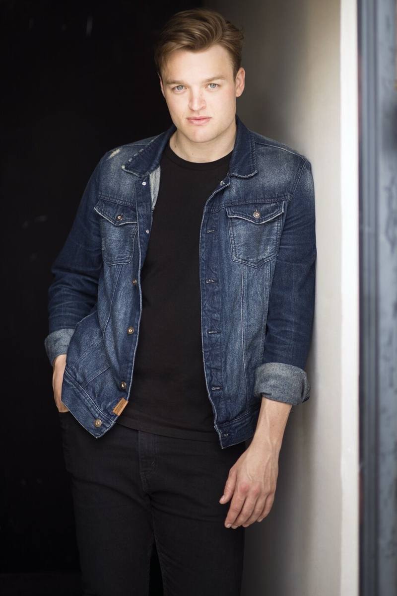 Haydan Hawkins earlier headshot, denim jacket